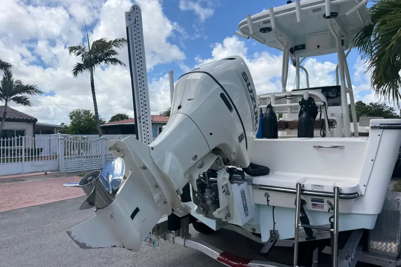 Slide: The Image of 2020 Sea Pro 210 Center Console boat with Suzuki outboard motor, parked on a trailer. - 36