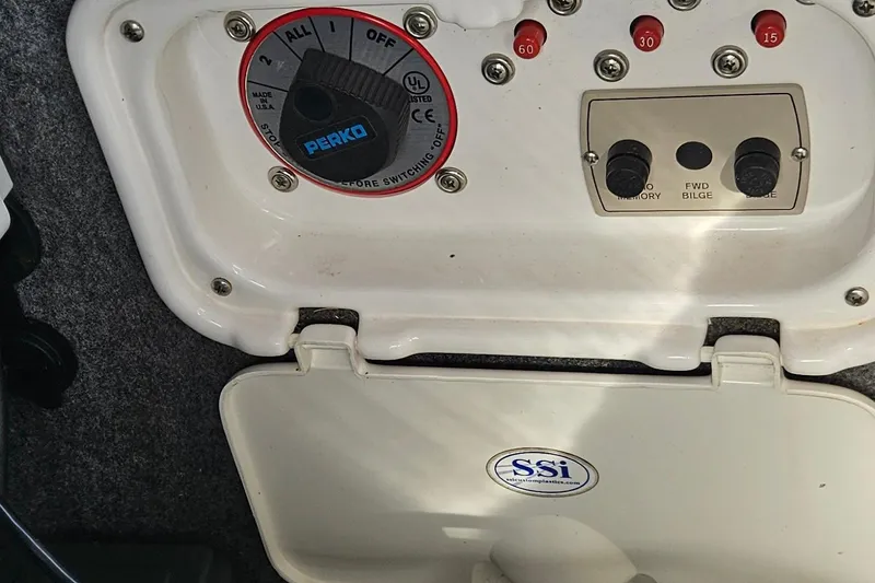 Slide: The Image of Control panel of a 2010 Regal 2700 ES Bowrider boat with Perko switch. - 18