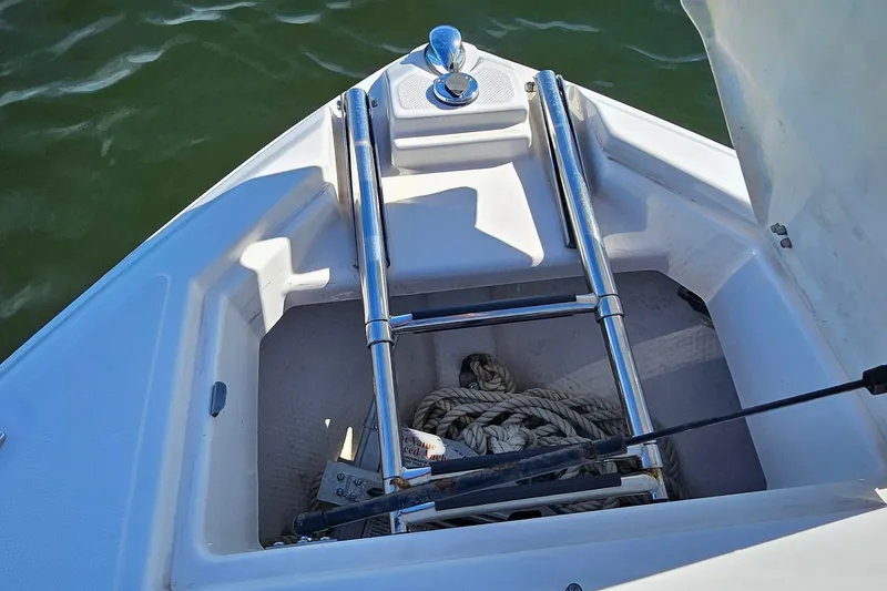 Slide: The Image of Bow storage area of 2010 Regal 2700 ES Bowrider with anchor and rope. - 28