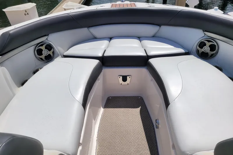 Slide: The Image of 2010 Regal 2700 ES Bowrider interior with cushioned seating and speakers. - 5