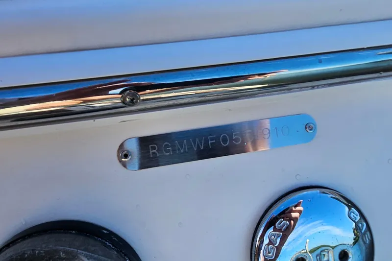 Slide: The Image of 2010 Regal 2700 ES Bowrider boat identification plate and gas cap. - 63