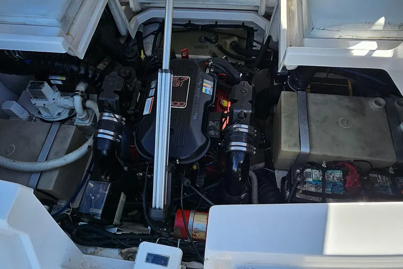 Slide: The Image of Engine compartment of a 2010 Regal 2700 ES Bowrider, showcasing mechanical components. - 65