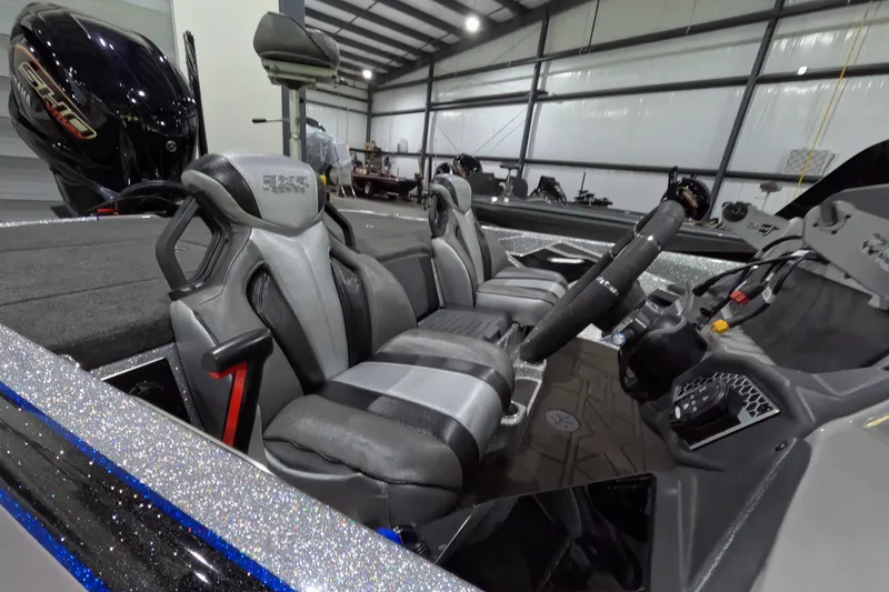 Slide: The Image of 2025 Skeeter boat interior with sleek seats and modern dashboard in a spacious garage. - 10