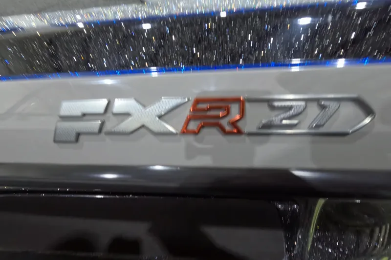 Slide: The Image of 2025 Skeeter FXR 21 emblem with metallic finish and glittering background. - 11