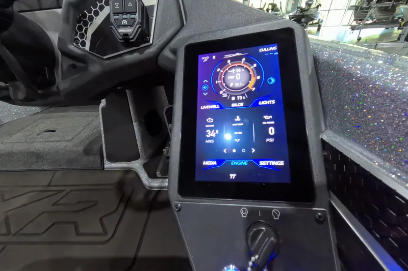 Slide: The Image of 2025 Skeeter boat dashboard with digital display showing engine and system settings. - 15