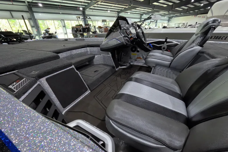 Slide: The Image of Interior of a 2025 Skeeter boat featuring sleek seating and modern dashboard controls. - 3