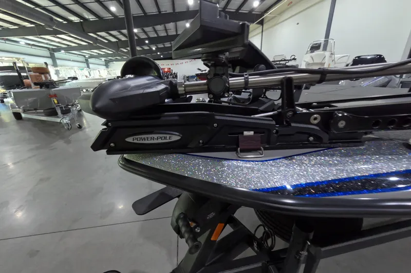 Slide: The Image of 2025 Skeeter boat with Power-Pole anchor system in a showroom. - 5