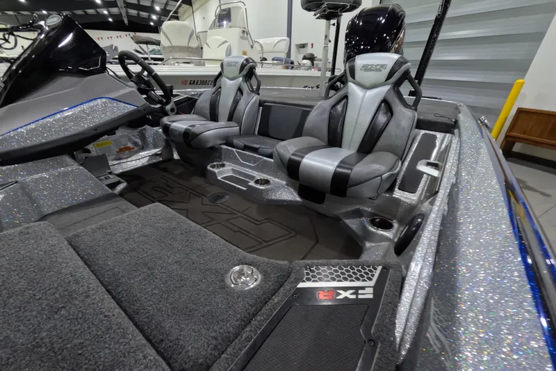 Slide: The Image of 2025 Skeeter boat interior with sleek seats and modern dashboard design. - 8
