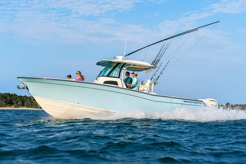 The Image of 2025 Grady-White Canyon 306 boat on calm water, showcasing sleek design and spacious deck. - 0