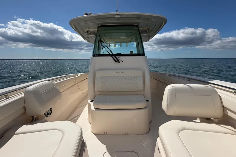 Slide: The Image of 2025 Grady-White Canyon 306 boat interior with ocean view and clear sky. - 25