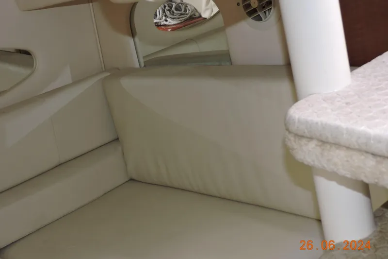 Slide: The Image of Interior cabin of 2002 Sea Ray 310 Sundancer with beige upholstery and seating area. - 15