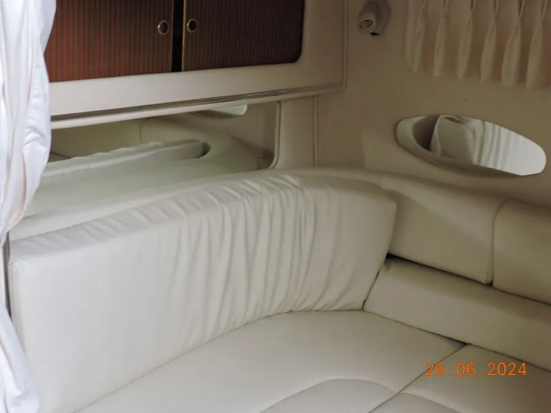 Slide: The Image of Interior cabin of 2002 Sea Ray 310 Sundancer with white upholstery. - 18