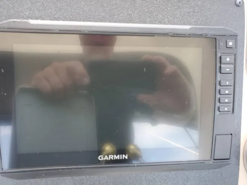 Slide: The Image of Garmin navigation system on 2002 Sea Ray 310 Sundancer boat dashboard. - 24