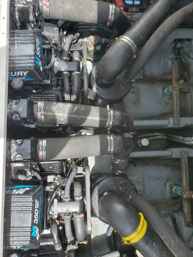Slide: The Image of Engine compartment of 2002 Sea Ray 310 Sundancer with Mercury 350 engines. - 46