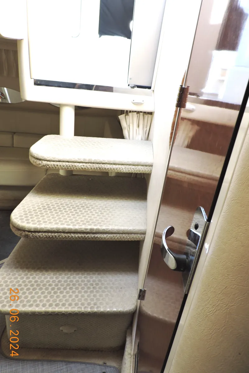 Slide: The Image of Interior stairs of a 2002 Sea Ray 310 Sundancer yacht. - 8