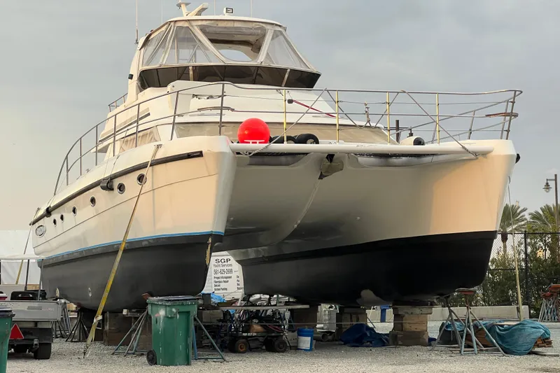 Slide: The Image of 2009 Africat Marine 420 yacht on dry dock, undergoing maintenance. - 11