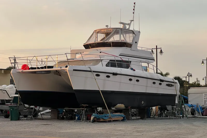 Slide: The Image of 2009 Africat Marine 420 yacht on dry dock at sunset. - 13