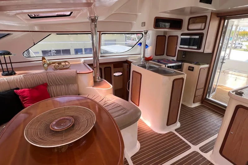 Slide: The Image of Luxurious 2009 Africat Marine 420 yacht interior with modern kitchen and cozy seating area. - 20