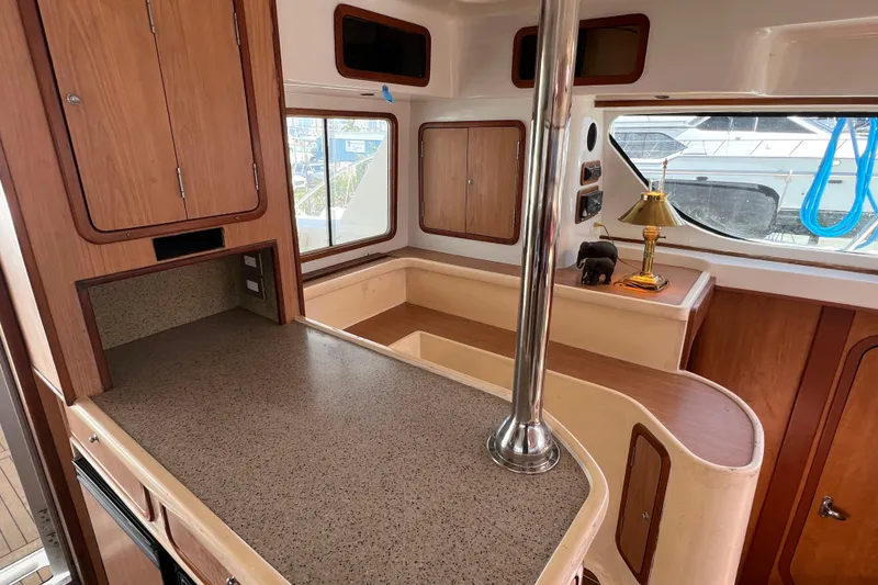 Slide: The Image of Interior of 2009 Africat Marine 420 yacht with wooden cabinetry and countertop. - 24