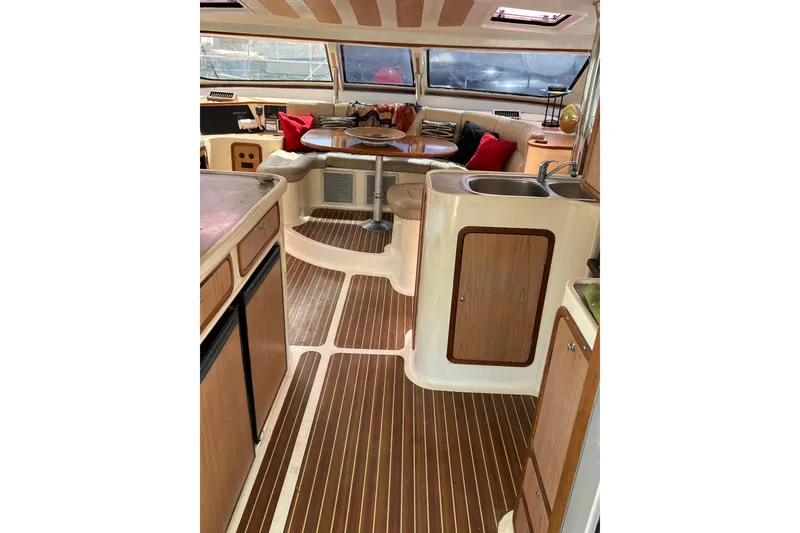 Slide: The Image of Luxurious 2009 Africat Marine 420 yacht interior with wood flooring and cozy seating area. - 25