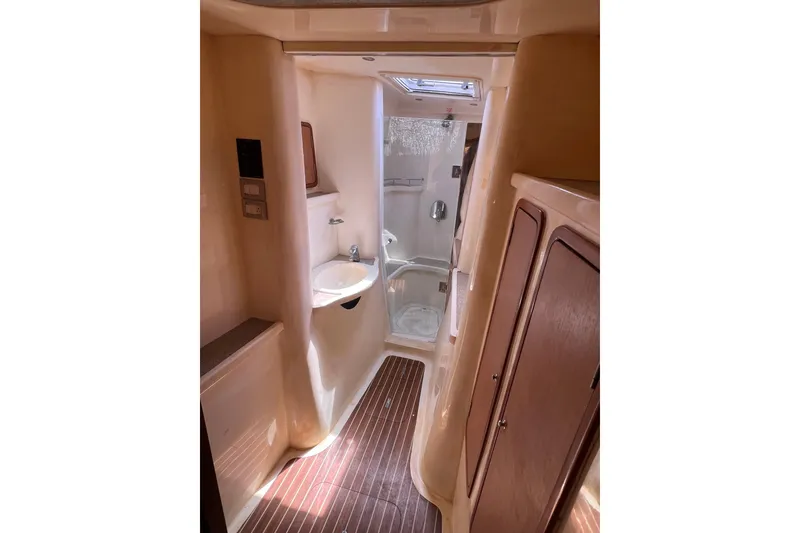 Slide: The Image of Luxurious 2009 Africat Marine 420 yacht bathroom with modern fixtures and wood accents. - 28