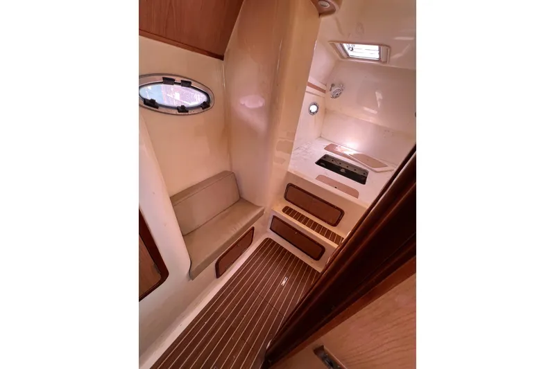 Slide: The Image of Interior of 2009 Africat Marine 420 yacht, featuring seating and wooden flooring. - 32