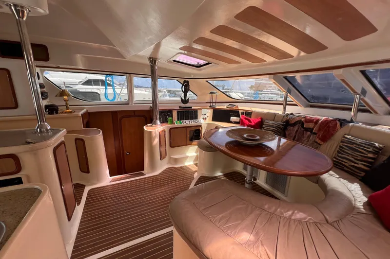 Slide: The Image of Luxurious interior of 2009 Africat Marine 420 yacht with elegant seating and wooden accents. - 33