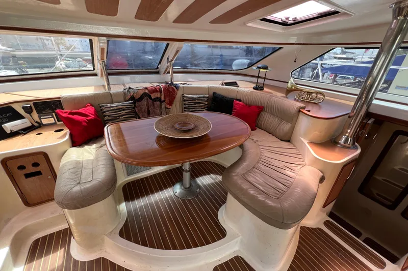 Slide: The Image of Luxurious 2009 Africat Marine 420 yacht interior with plush seating and elegant wooden table. - 35