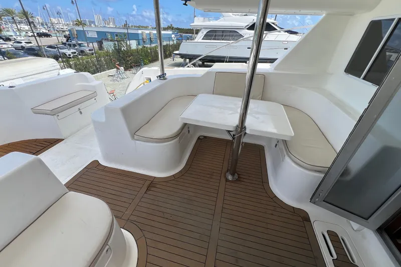 Slide: The Image of Outdoor seating area on a 2009 Africat Marine 420 yacht with wooden flooring. - 37
