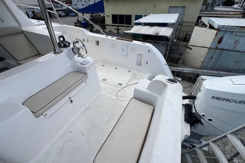 Slide: The Image of 2009 Africat Marine 420 boat interior with seating and Mercury engine. - 44