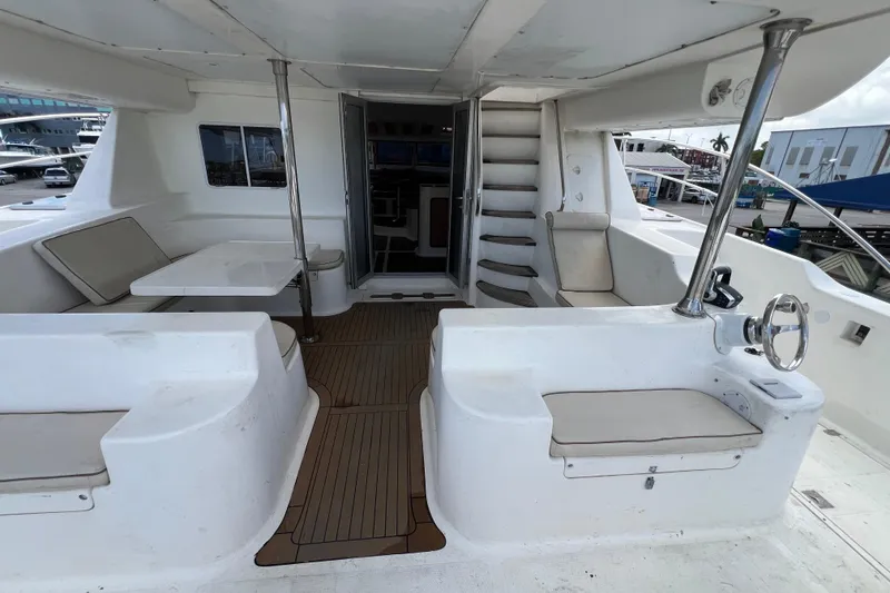Slide: The Image of 2009 Africat Marine 420 yacht interior with seating, table, and helm station. - 45
