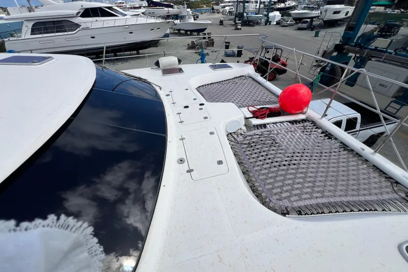 Slide: The Image of 2009 Africat Marine 420 yacht on deck, featuring netting and a red buoy. - 47