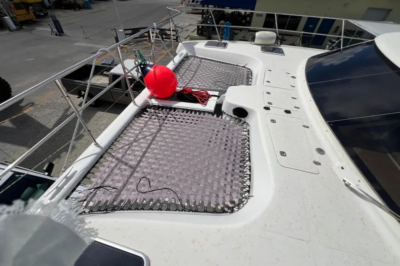 Slide: The Image of 2009 Africat Marine 420 catamaran deck with netting and red buoy. - 50