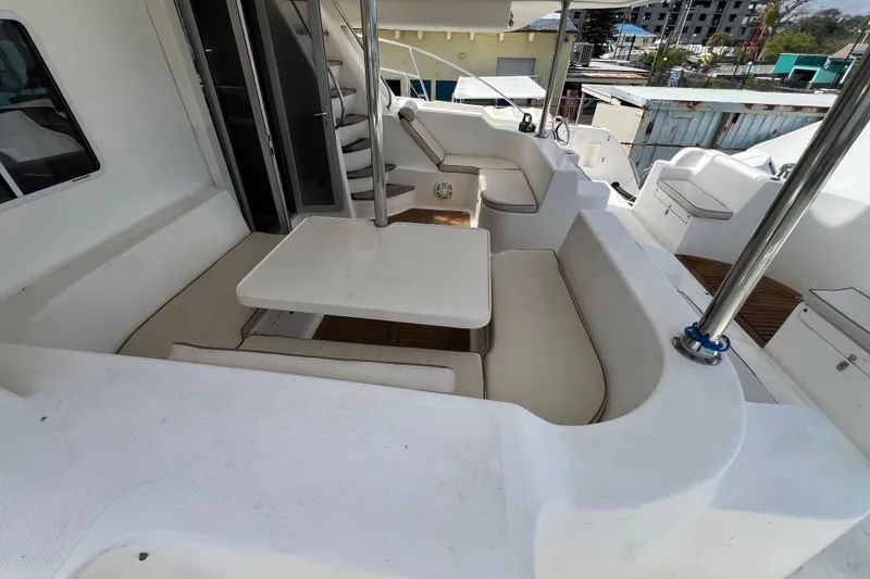 Slide: The Image of 2009 Africat Marine 420 yacht interior with seating and table, featuring modern design elements. - 51