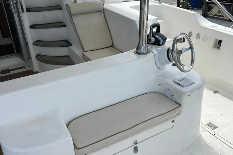 Slide: The Image of Helm station of 2009 Africat Marine 420 yacht with steering wheel and seating. - 52