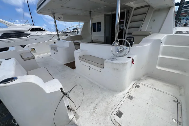 Slide: The Image of Spacious deck of 2009 Africat Marine 420 yacht with seating and steering wheel. - 54