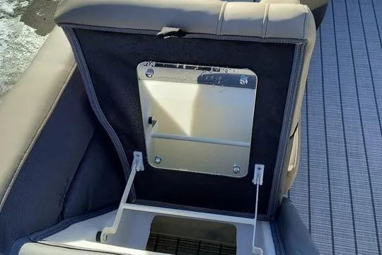 Slide: The Image of Open storage compartment in Viaggio V22U boat seat, 2026 model, with gray upholstery. - 12