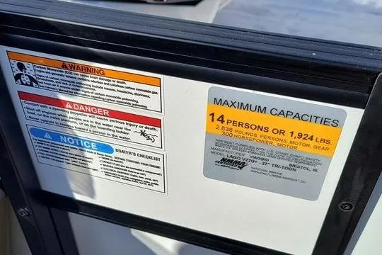Slide: The Image of Safety and capacity labels on a 2026 Viaggio V22U boat, indicating 14-person limit. - 14