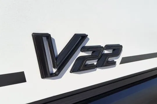 Slide: The Image of 2026 Viaggio V22U emblem on a sleek white surface. - 2