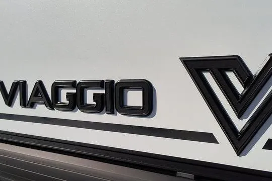 Slide: The Image of Viaggio V22U 2026 logo on vehicle exterior, sleek black lettering on white background. - 3
