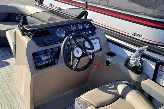Slide: The Image of Interior view of 2026 Viaggio V22U boat dashboard with steering wheel and controls. - 5