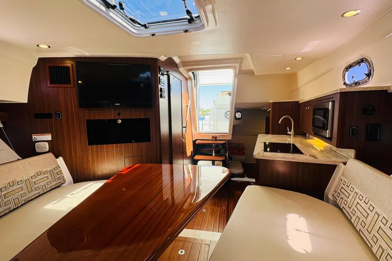 Slide: The Image of Luxurious interior of 2021 Pursuit OS 355 Offshore boat with modern amenities. - 41
