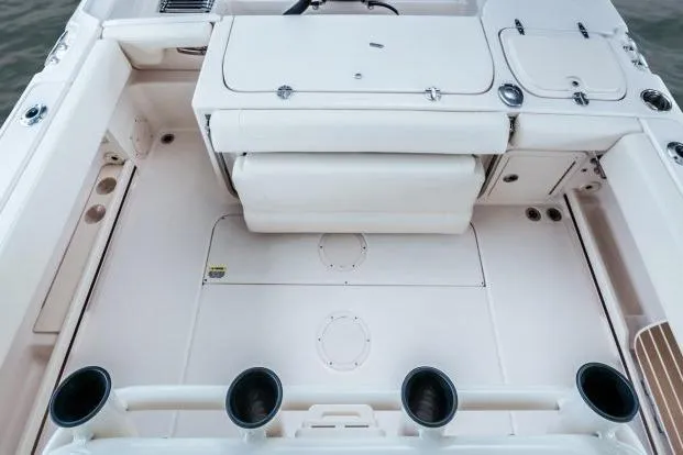 Slide: The Image of 2025 Grady-White Fisherman 257 boat interior with rod holders and storage compartments. - 3