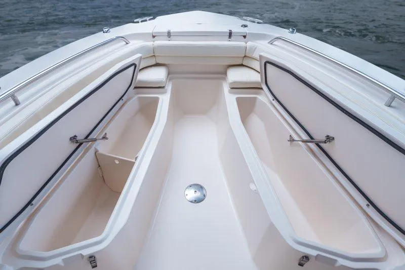 Slide: The Image of 2025 Grady-White Fisherman 257 boat interior with open storage compartments and seating. - 8