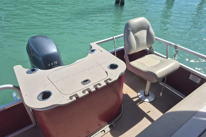 Slide: The Image of 2012 Bennington 22 SSI boat with Yamaha 115 engine, featuring a fishing seat and console. - 10