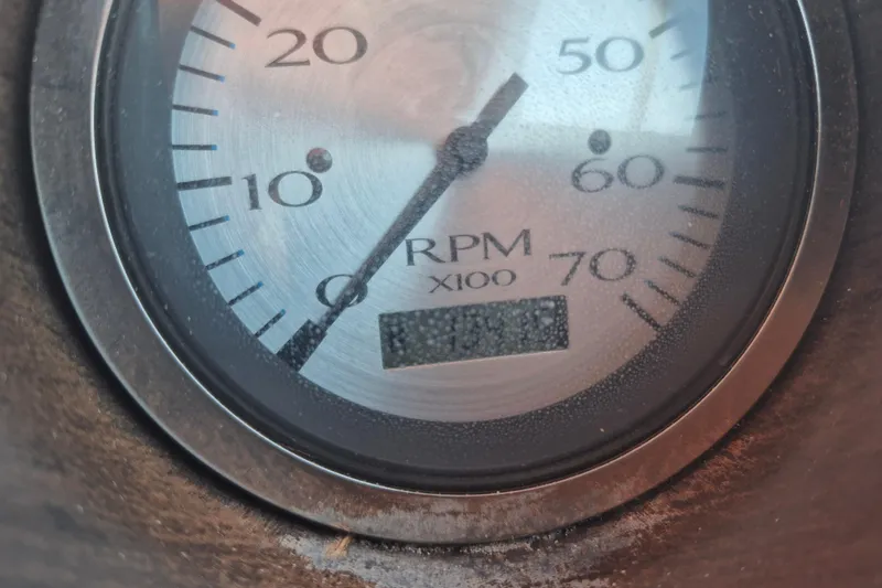 Slide: The Image of Close-up of a 2012 Bennington 22 SSI RPM gauge displaying engine revolutions. - 13