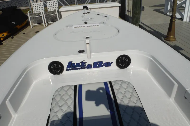 Slide: The Image of 2023 Lake & Bay 21 Boca Grande boat deck with logo and seating area. - 8