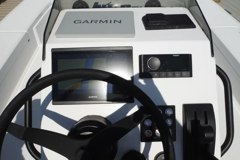 Slide: The Image of Dashboard display of 2023 Lake & Bay 21 Boca Grande boat showing engine metrics. - 16