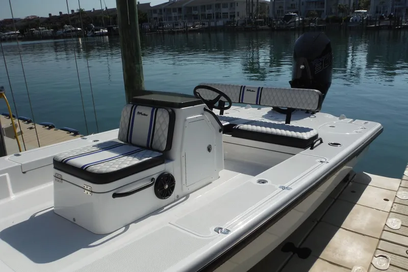 Slide: The Image of 2023 Lake & Bay 21 Boca Grande boat docked by calm waters. - 2