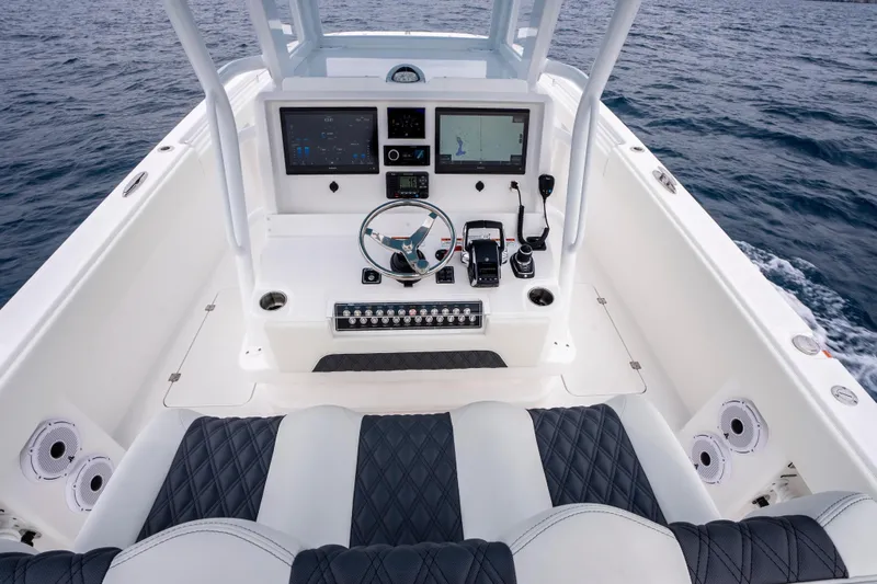 Slide: The Image of Cockpit of 2024 Invincible 33 Catamaran with modern controls. - 16